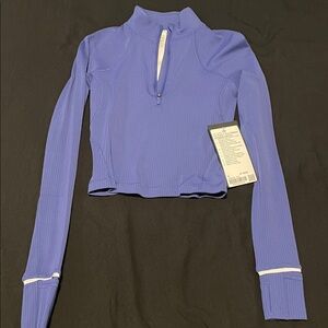 It’s rulu run ribbed cropped half zip